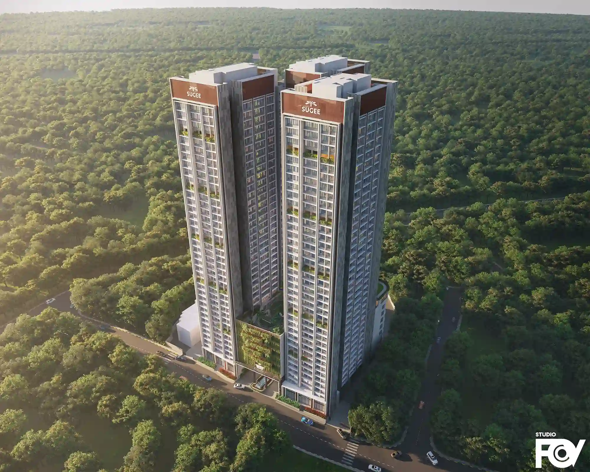 Aerial view of modern high-rise residential building complex with two towers and greenery.