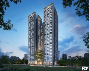 Evening View of Modern high-rise residential building complex with two towers, sky bridge, and city lights.